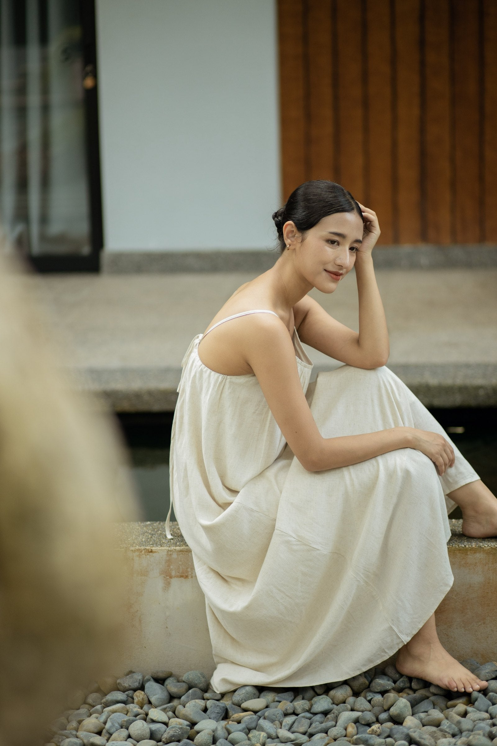 SHOPLOOOH Re Collection natural white cotton-linen camisole dress, seated by the water